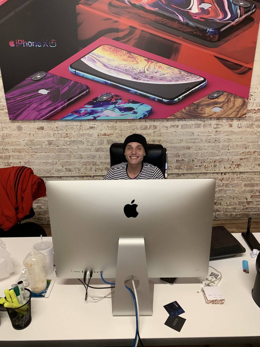 Austin Sparks at his desk at DesignSkinz