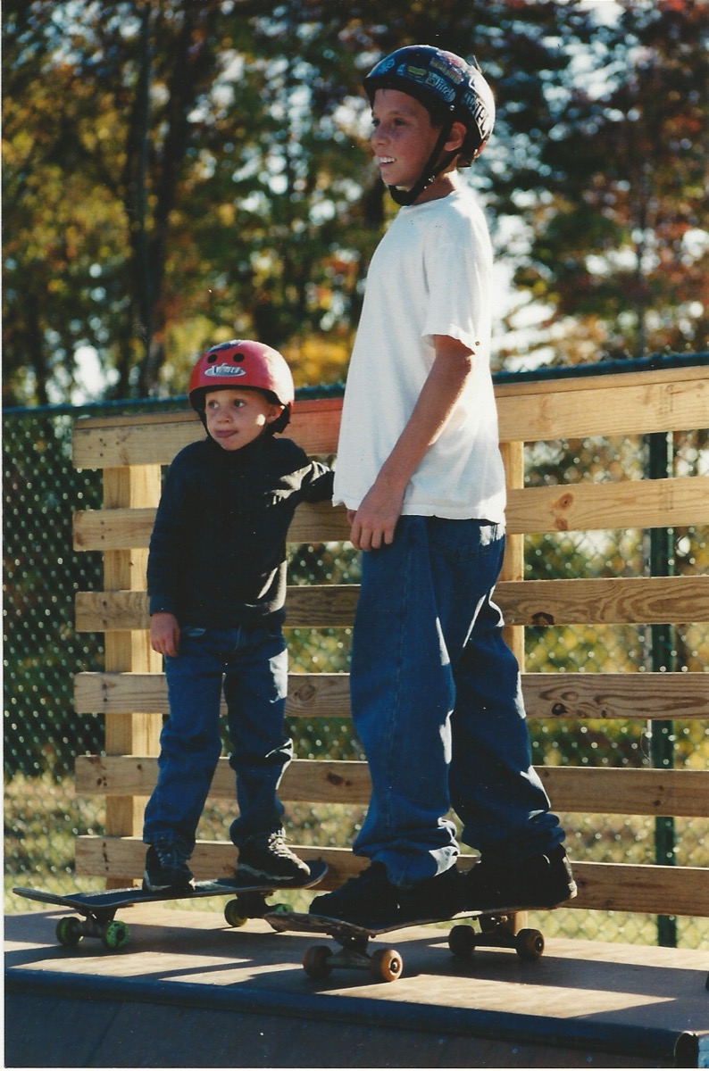 Kyle and young Austin at the skate park as kids